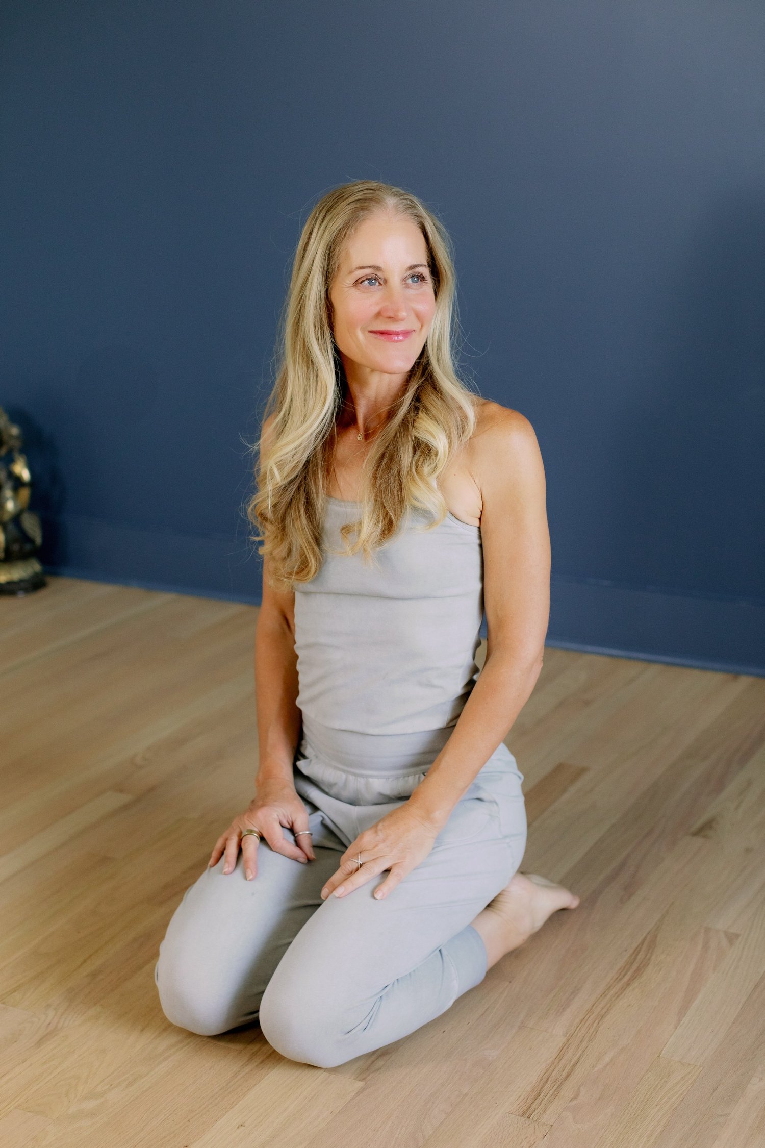 kari seated in virasana with mudra